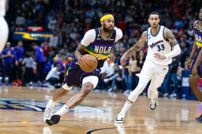 Jan 28, 2023; New Orleans, Louisiana, USA; New Orleans Pelicans guard Devonte' Graham (4) drives to the basket against Washington Wizards forward Kyle Kuzma (33) during the first half at Smoothie King Center. Mandatory Credit: Stephen Lew-USA TODAY Sports